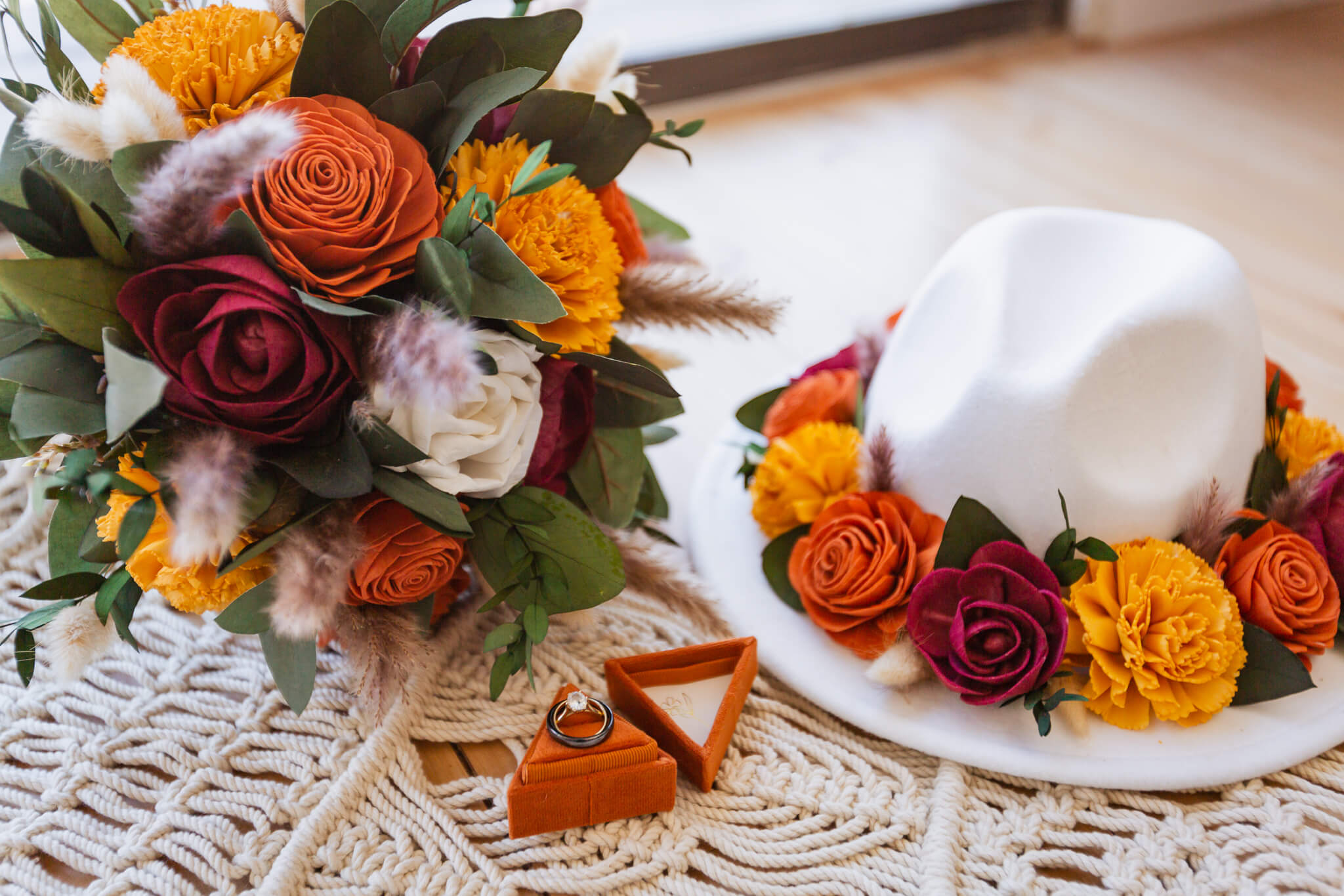Wedding details: Bride's bouquet, ring, and hat