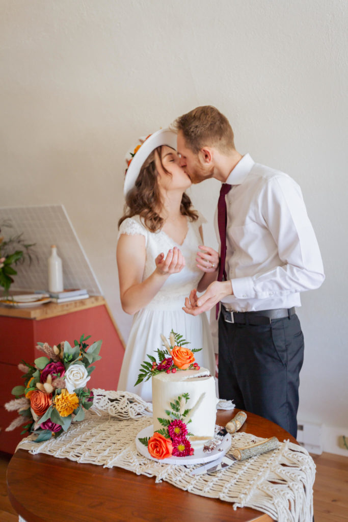 Bride and groom's celebratory kiss before cake!
