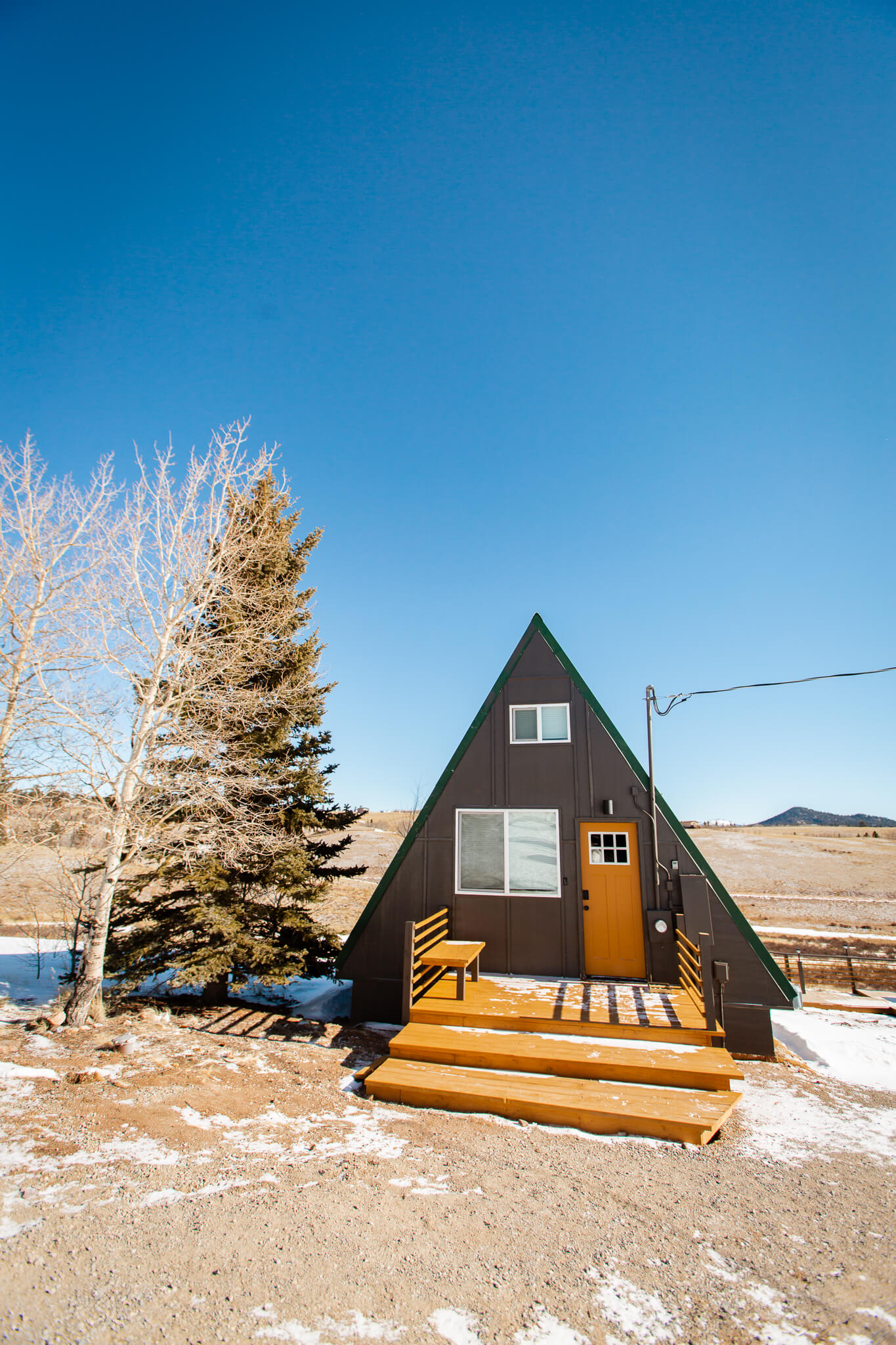 Portrait of tiny A-frame cabin