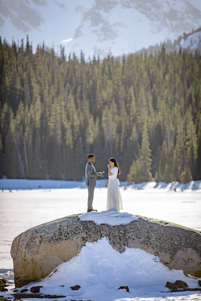 couple holding each other in rocky mountain national park