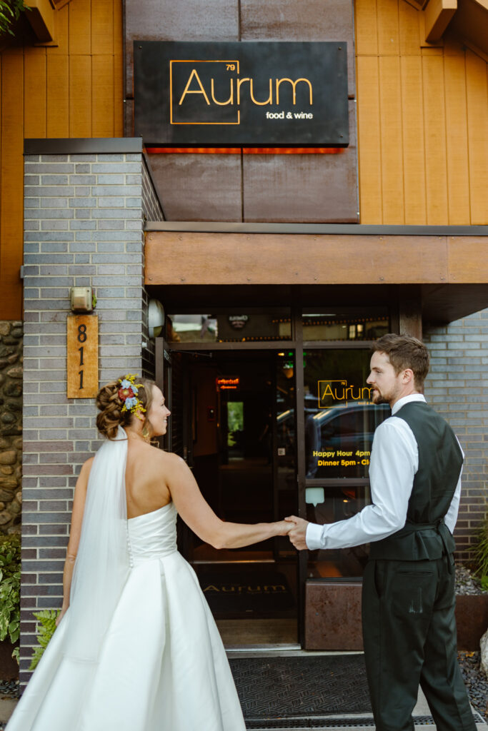Newlyweds stand in front of Aurum in Steamboat Springs where they had their reception